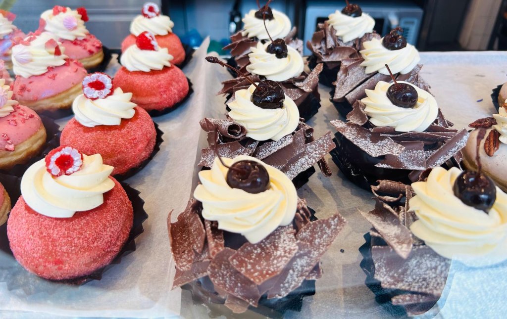 Cupcakes are laid out on a baking tray.
